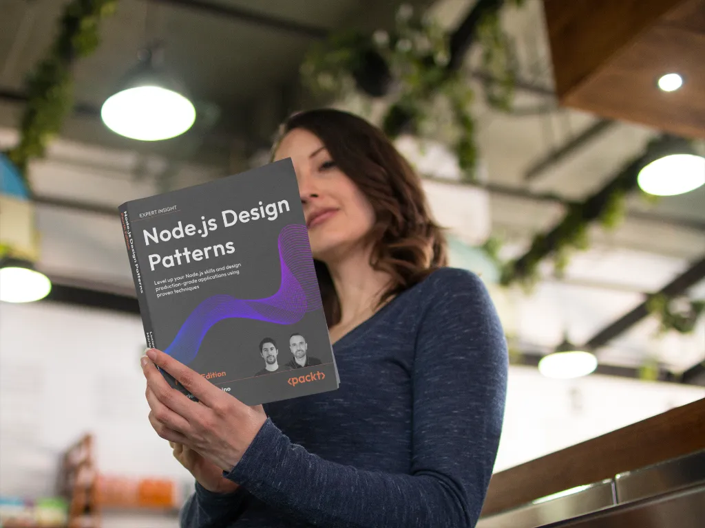 Lifestyle shot of a woman in a cafe holding the 'Node.js Design Patterns – Fourth Edition' book; greenery and warm lights in the background, cover fully visible.
